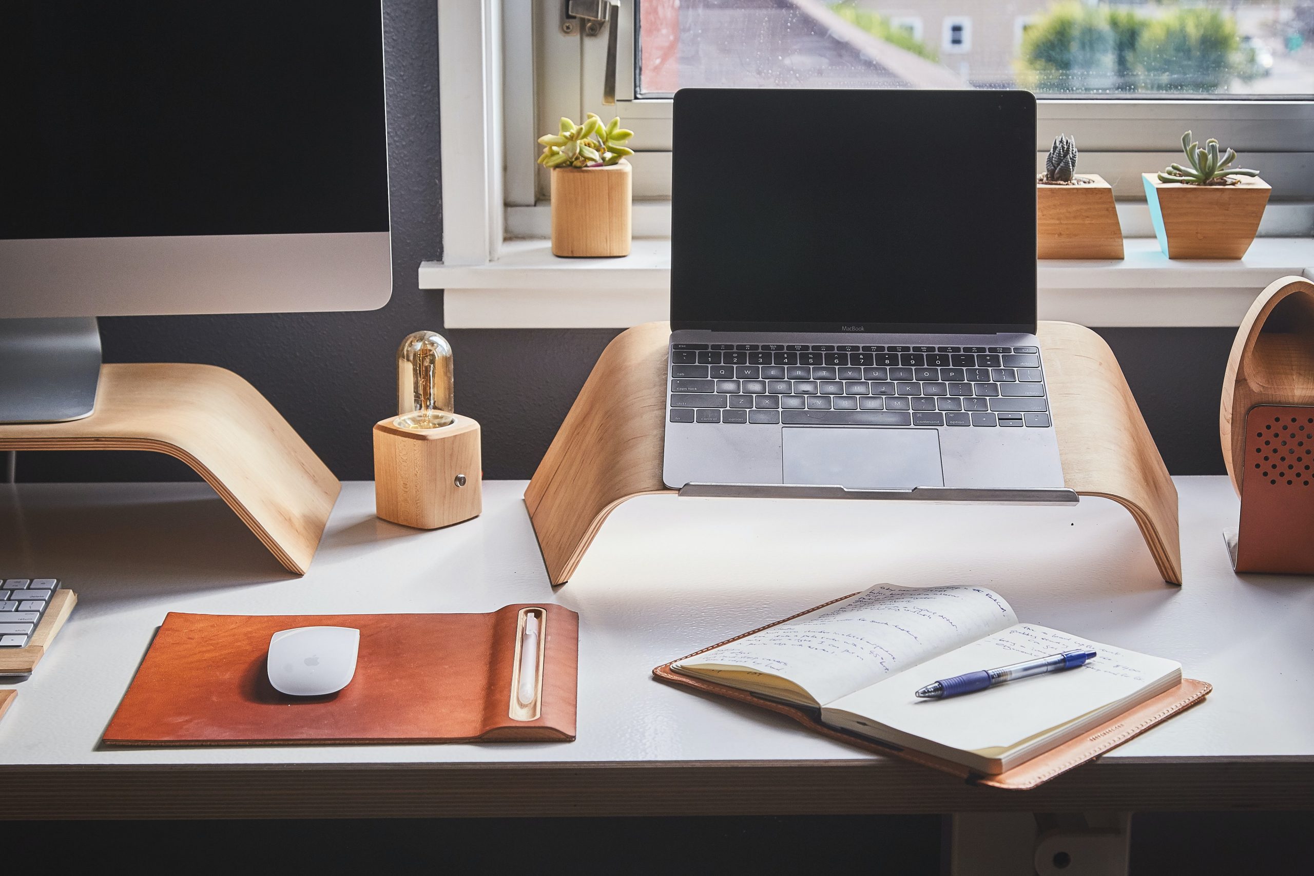 Clean Organized Office Desk with Laptop and Notebook